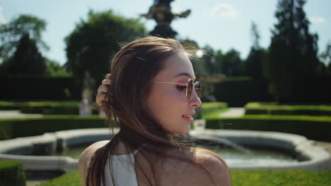 woman in a park near a fountain