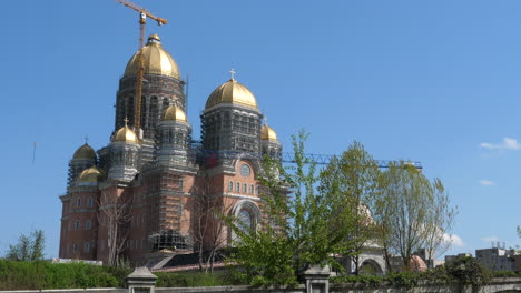 tower cranes at construction site of an orthodox cathedral in bucharest