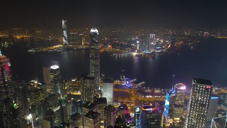 iluminación nocturna bahía de la ciudad de hong kong famoso kowloon panorama aéreo 4k china