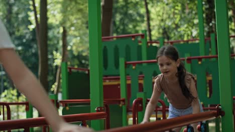 Group-of-girls-playing-at-the-playground-in-summer-day.