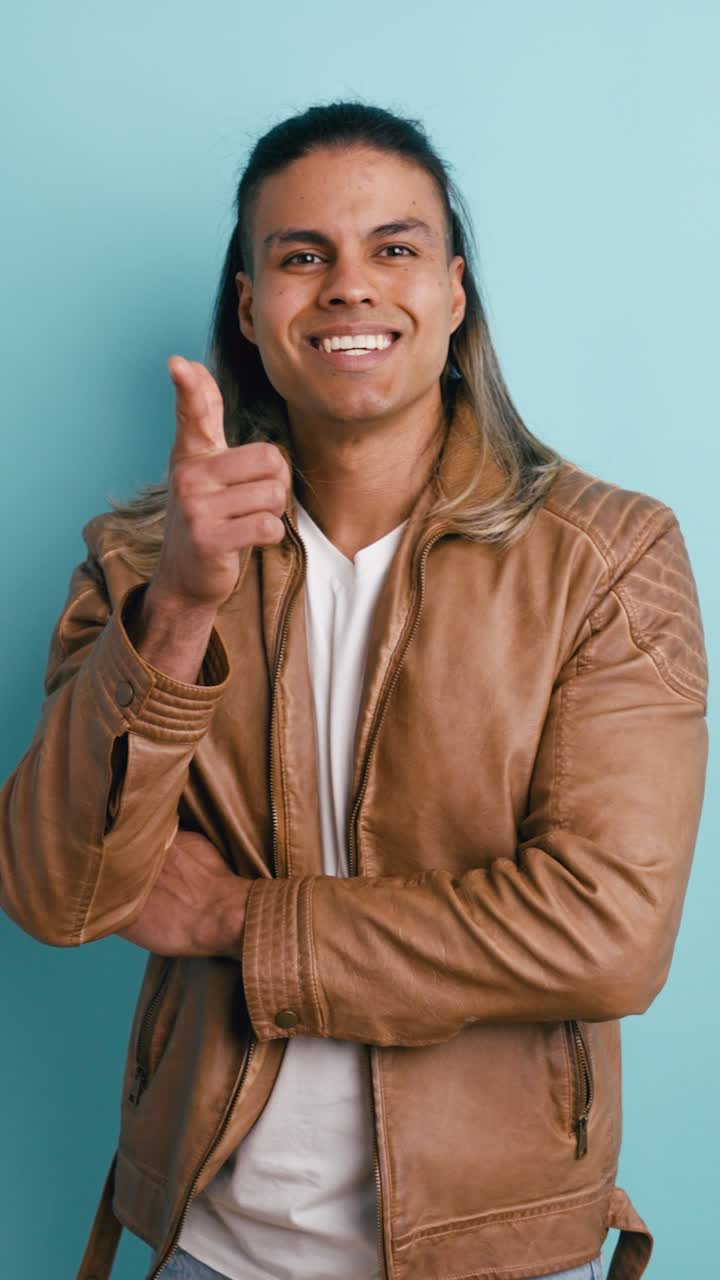 Young Man Thinking, Getting an Idea, and Pointing Confidently