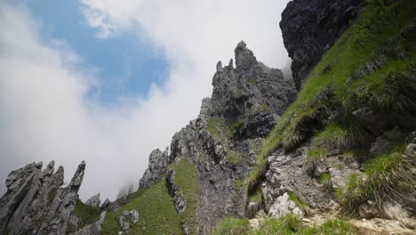 lombardy, italy - a picturesque view of rugged, jagged peaks set against a cloudy sky in grignetta - low angle shot