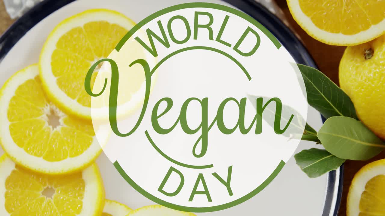 Animation of world vegan day text over fresh fruit