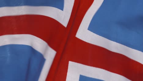 iceland flag blowing in wind in slow motion close-up