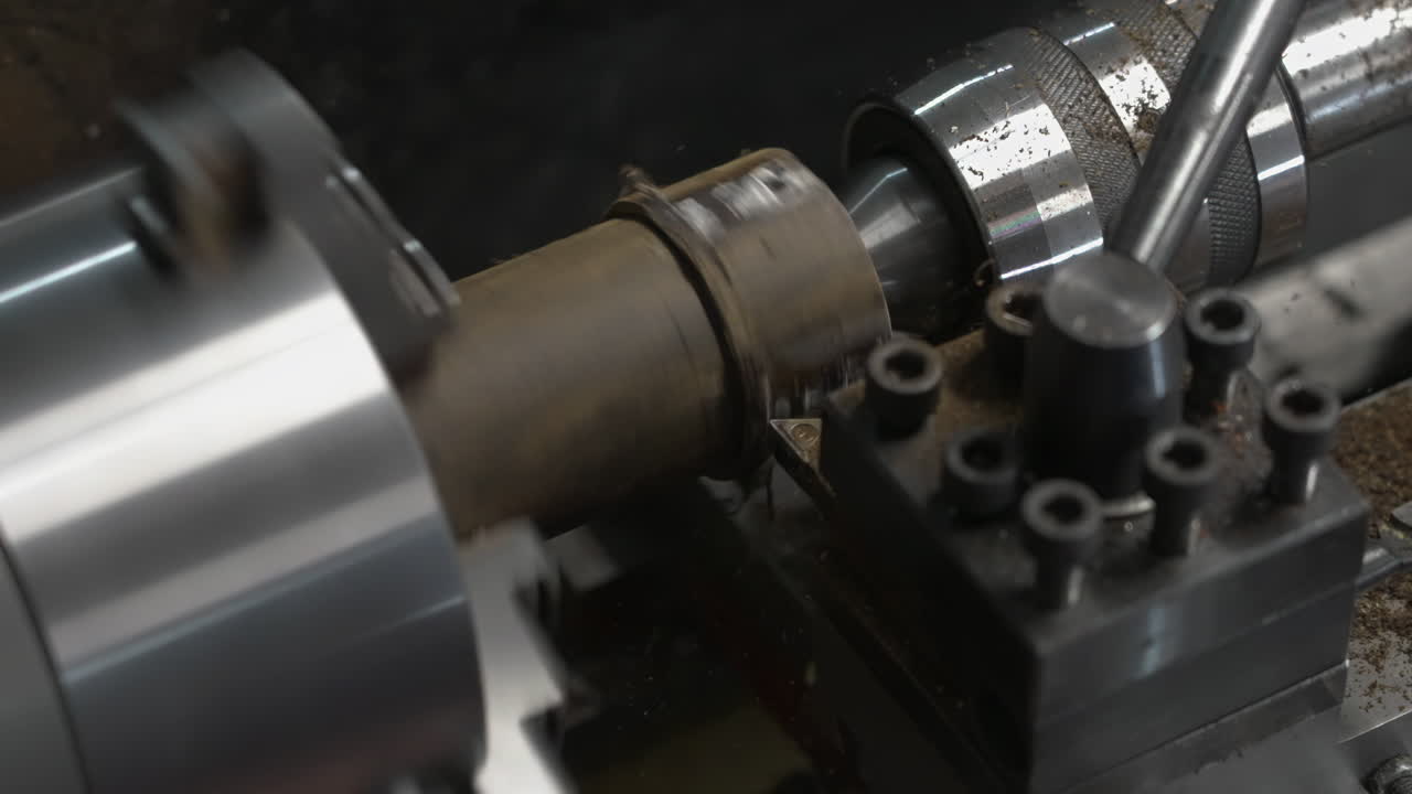 Closeup of Wood Lathe Machine Boring Hole Into Cylindrical Workpiece At Workshop. slow motion, zoom-in shot