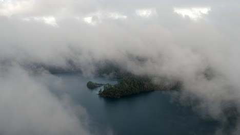 Aerial-shot-of-the-clouds-and-the-Tziscao-Lake,-Montebello-National-Park,-Chiapas