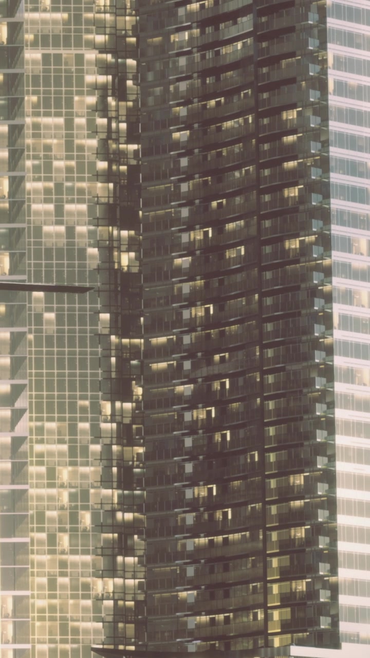 Edifícios modernos em área urbana mostrando reflexos e fachadas de vidro.