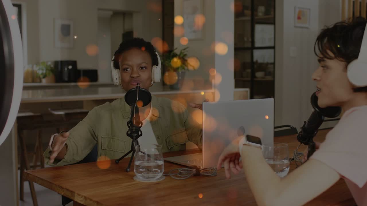 Woman starting discussion, man responding in kitchen, podcast with mic, ringlight, bokeh over hosts