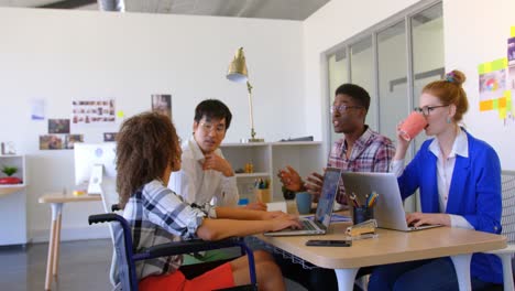 multi-ethnic business people interacting with each other in modern office 4k