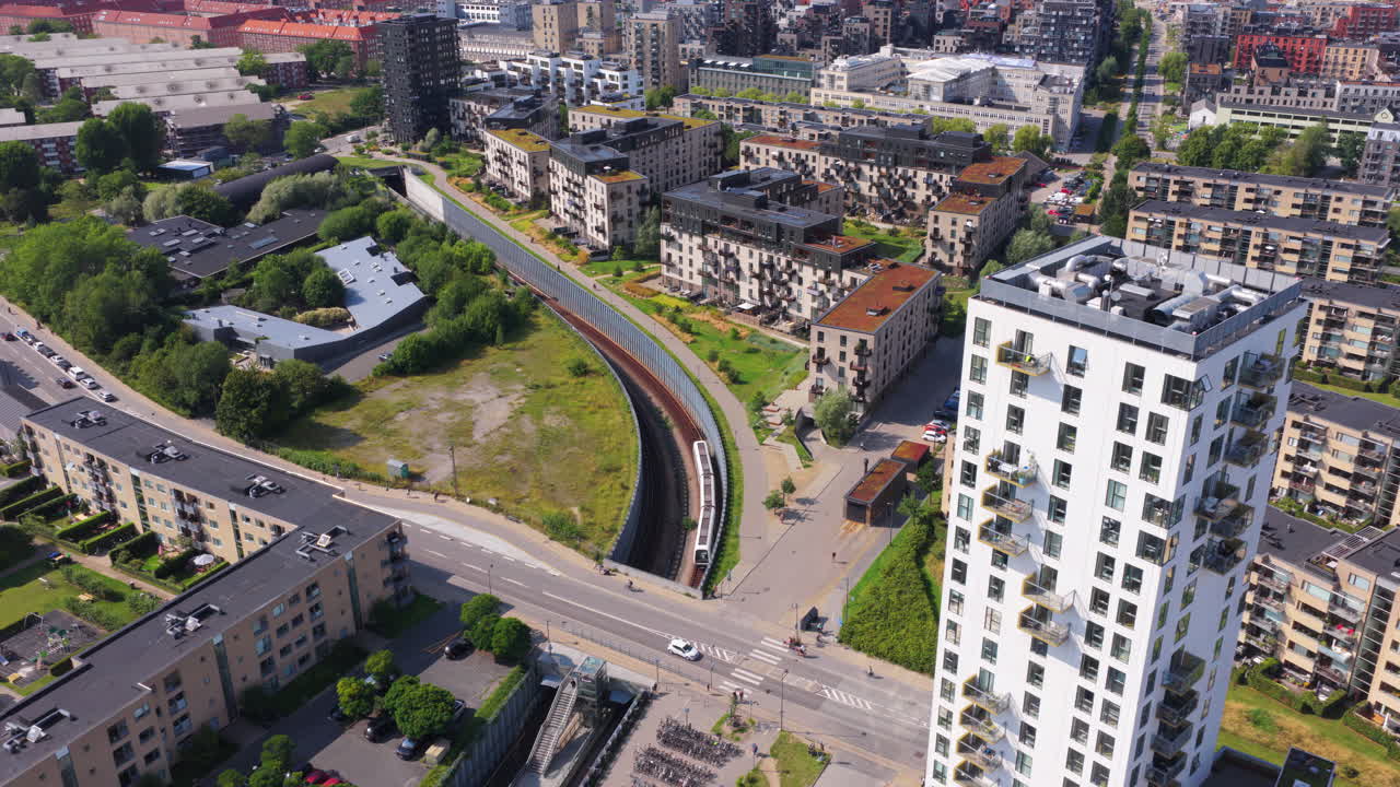 Aerial drone view of Oresund Metro Station and surrounding Amager apartments, showing modern high-rises and residential blocks