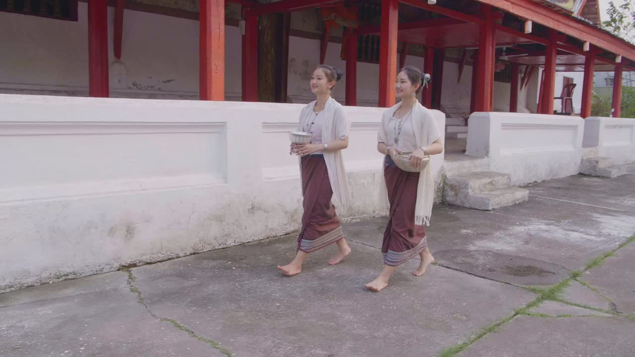 Thai Women Offering at a Temple