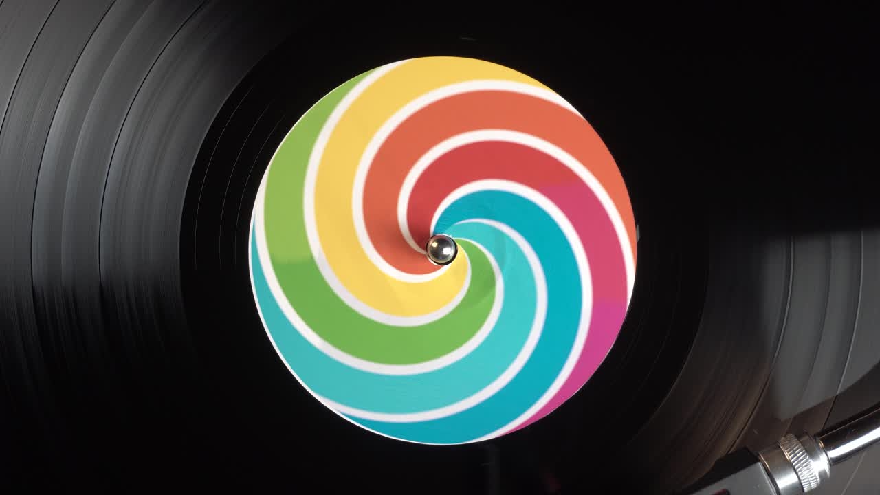 Spinning Long Play Vinyl Record With Colorful Optical Illusion Sticker, Top Down View