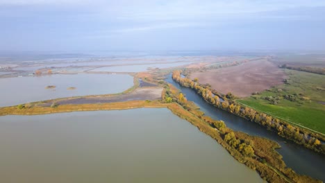wide aerial view of fish farm ponds and water channels