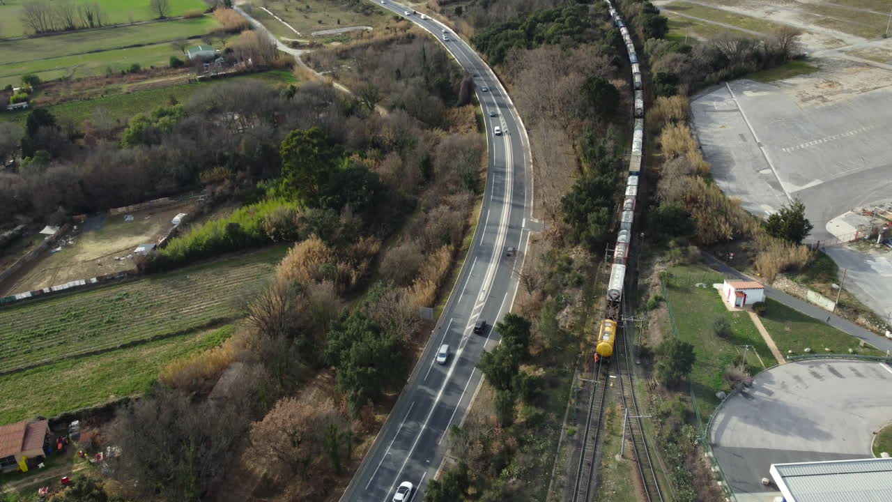 Aerial View of Highway and Train Tracks Through Countryside