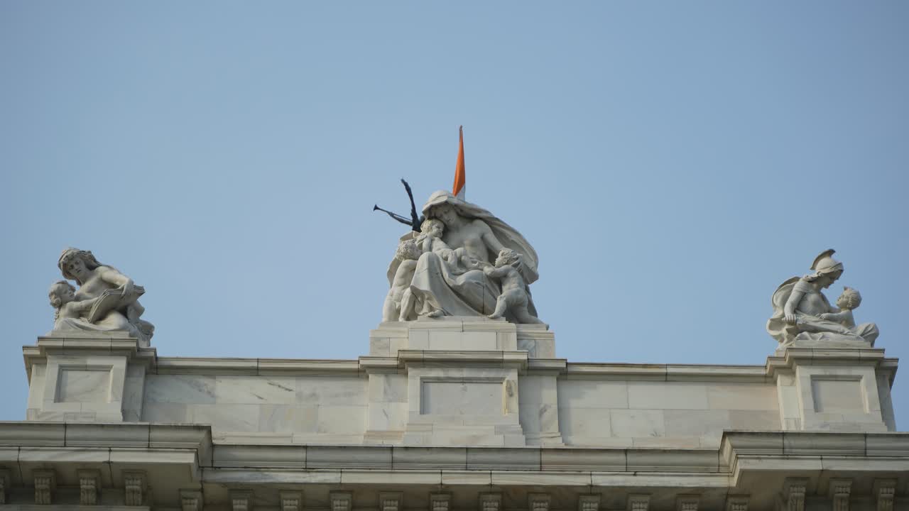 Detailed View of Statues on a Building Rooftop