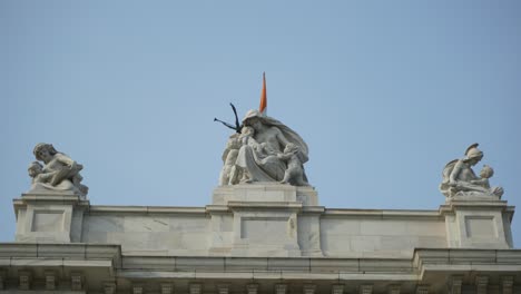 detailed view of statues on a building rooftop