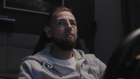 Man Focused on Video Game Racing Simulation