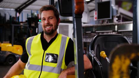 engineer smiling in bottle factory