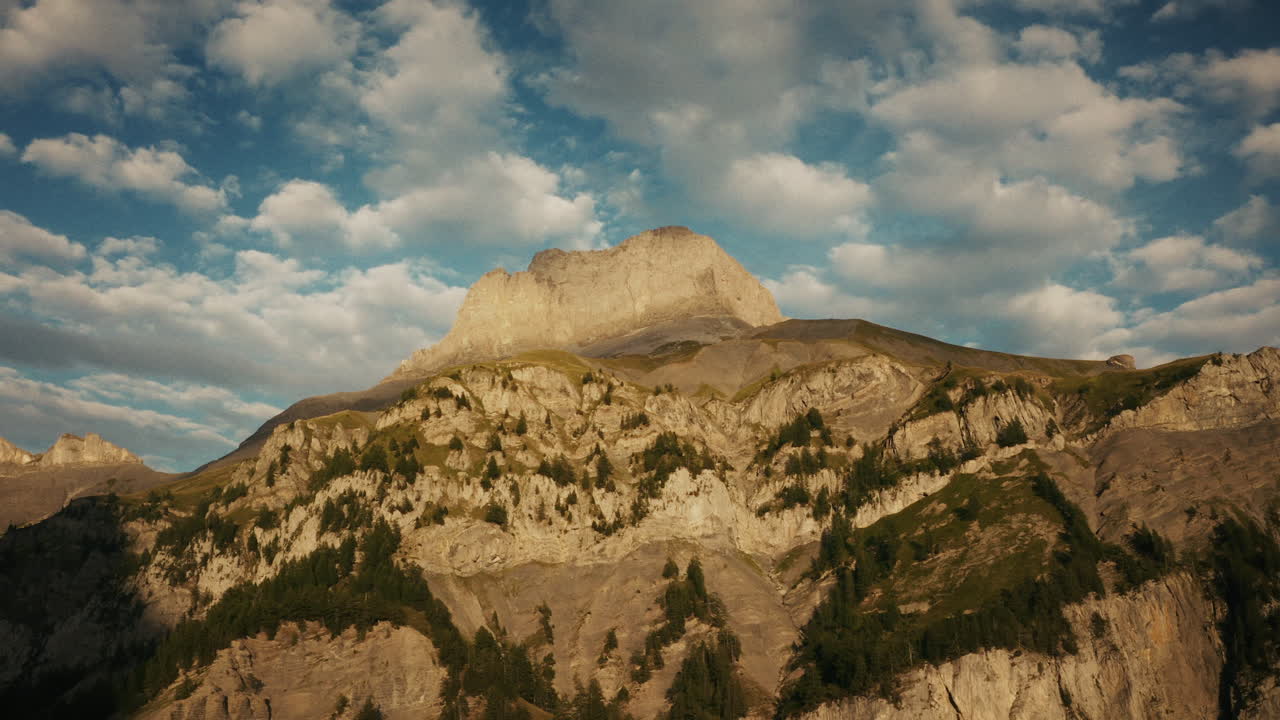 Majestic Mountain Peak Under a Cloudy Sky