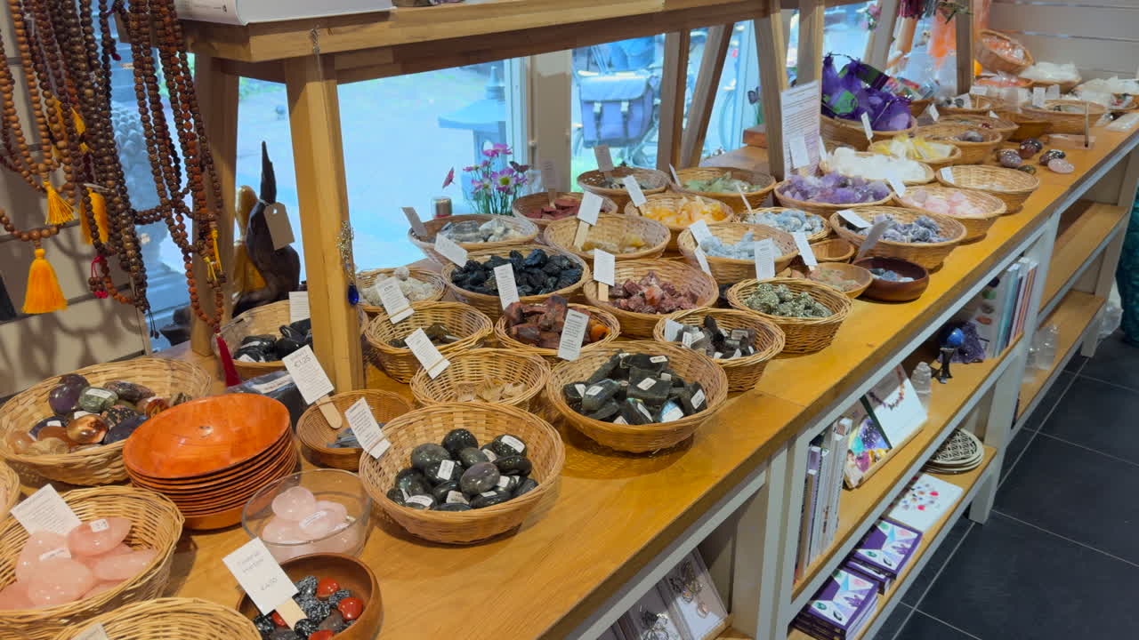Display of gemstones and japa malas in an esoteric shop.
