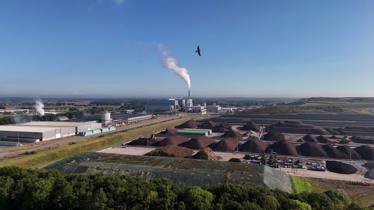 Aerial View of Industrial Plant with Smoke Stack