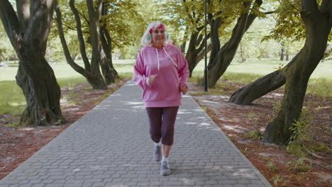 Athletic-fitness-senior-sport-runner-woman-grandmother-training-workout-cardio-in-park-at-morning