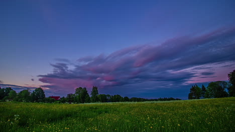 Beautiful-rainbow-during-golden-and-violet-sunset,-timelapse-to-blue-hour