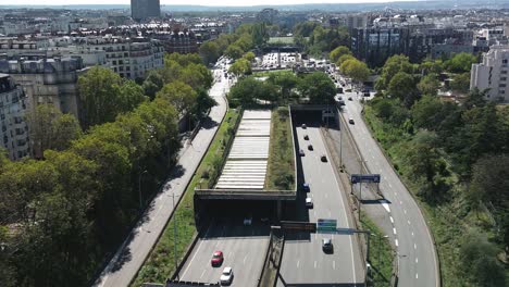 Urban-roads-of-Paris,-France.-Aerial-backward