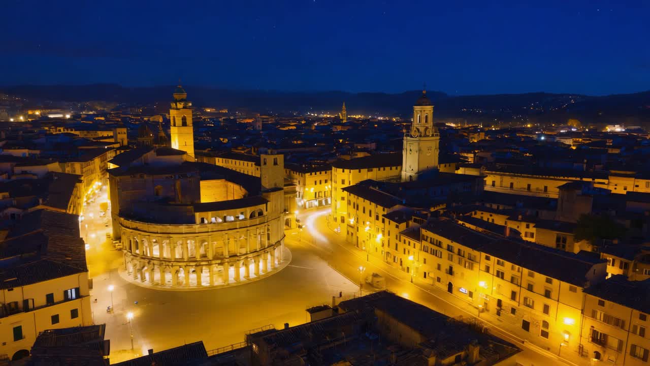 Vista aerea notturna del paesaggio urbano di Verona con l'Arena illuminata