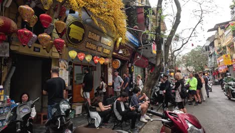 people gathered on a busy hanoi street