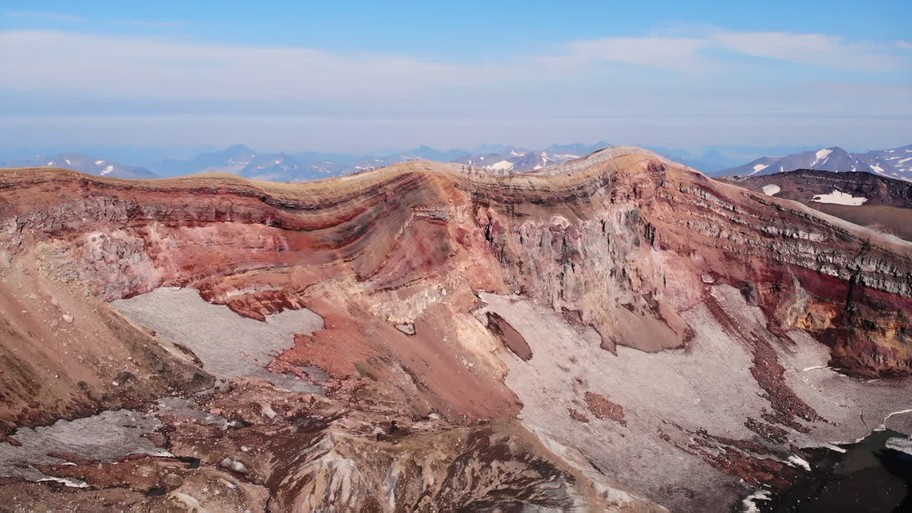Aerial view of a volcanic landscape with mountains and geological formations