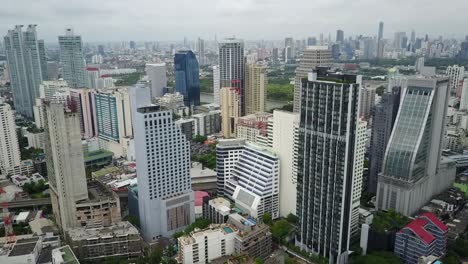 a stunning scenery of expensive buildings on a sunny day in bangkok, thailand - aerial shot