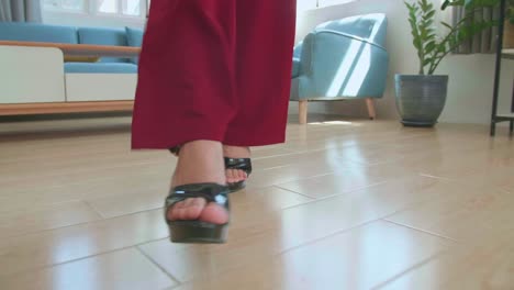 woman legs in high heel shoes walking in home