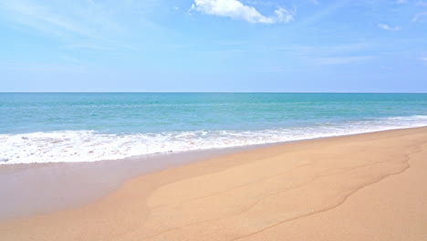 wave slowly rolling towards white sand beach cloudless sky, vacation template, copy space minimalistic