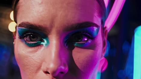 woman with bold makeup and neon lights