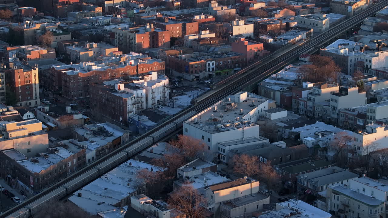 Aerial view of the subway passing through Brooklyn. Shot at dusk.