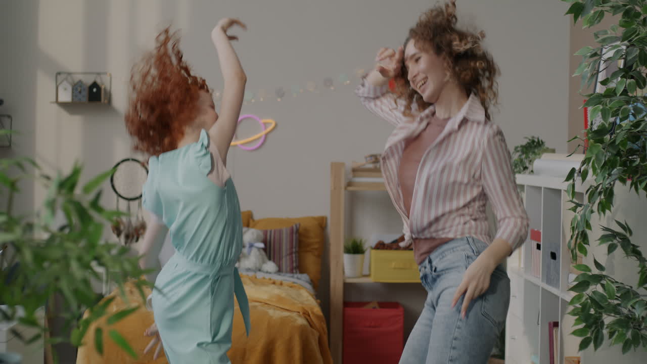 Two Girls Dancing in a Room