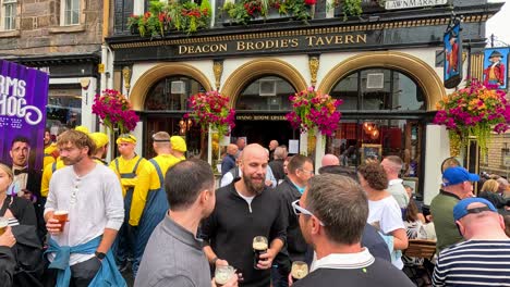 people socializing outside deacon brodie's tavern