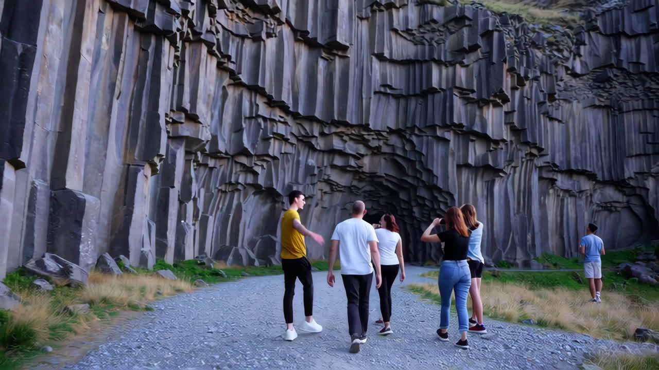 Group of people exploring a basalt canyon in Iceland
