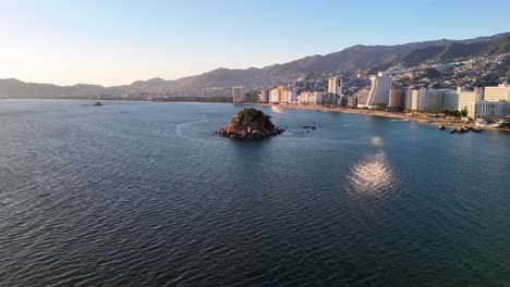 shot of little island in acapulco bay in mexico