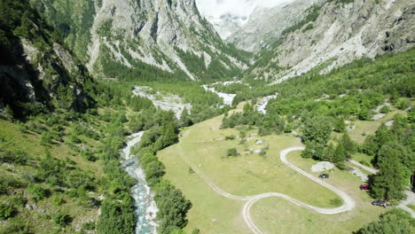 top down view of autumn forest, fall woodland with a river flowing