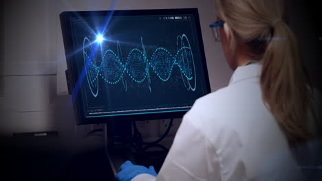 blue spot of light against rear view of caucasian female scientist using computer at laboratory