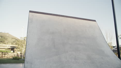 a young man out skating at a skatepark