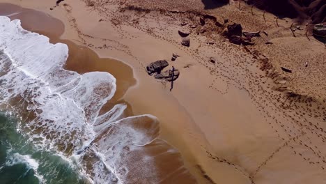 Cala-Pilar-beach-at-high-tide-in-Menorca-Spain-with-waves-calmly-rising-above-the-tide-line