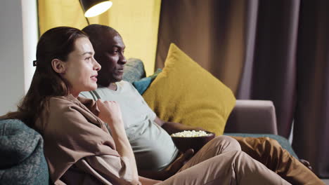 couple watching film at home