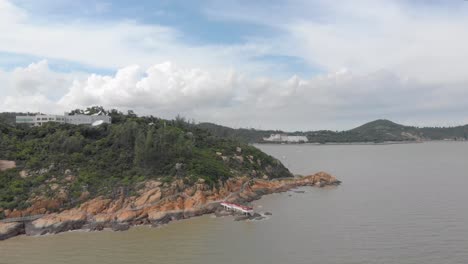 Rotating-and-ascending-aerial-view-of-Coloane-coastline,-Macau