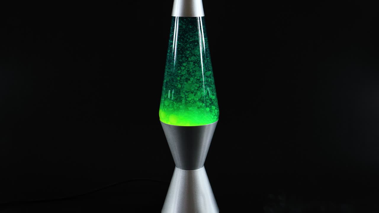 Green lava lamp with moving wax blobs