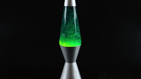 green lava lamp with moving wax blobs