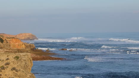 waves crashing against rocky coastal cliffs