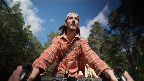 couple cycling in the forest